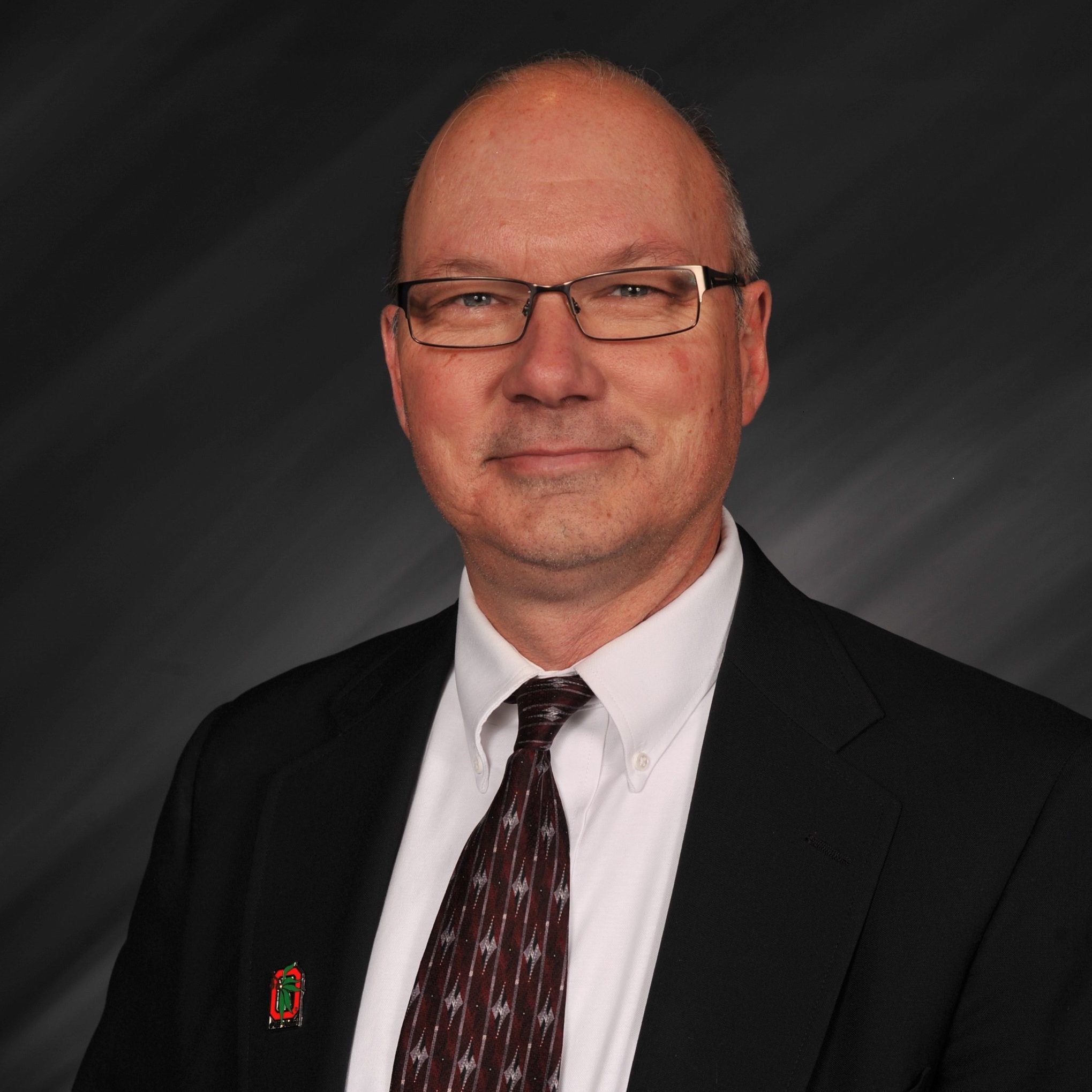 Headshot image of team member Kirk Reese